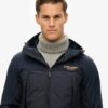 Hybrid-Trekker-Jacke mit Kapuze Hybrid-Trekker-Jacke mit Kapuze