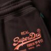 Jogginghose mit niedrigem Bund und ausgestelltem Bein sowie Neon-Vintage-Logo Jogginghose mit niedrigem Bund und ausgestelltem Bein sowie Neon-Vintage-Logo