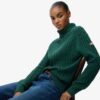 Locker sitzender Rollkragenpullover mit Zopfmuster Locker sitzender Rollkragenpullover mit Zopfmuster