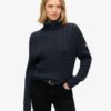 Locker sitzender Rollkragenpullover mit Zopfmuster Locker sitzender Rollkragenpullover mit Zopfmuster