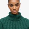 Locker sitzender Rollkragenpullover mit Zopfmuster Locker sitzender Rollkragenpullover mit Zopfmuster