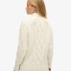 Pullover mit hohem Kragen und Zopfmuster Pullover mit hohem Kragen und Zopfmuster